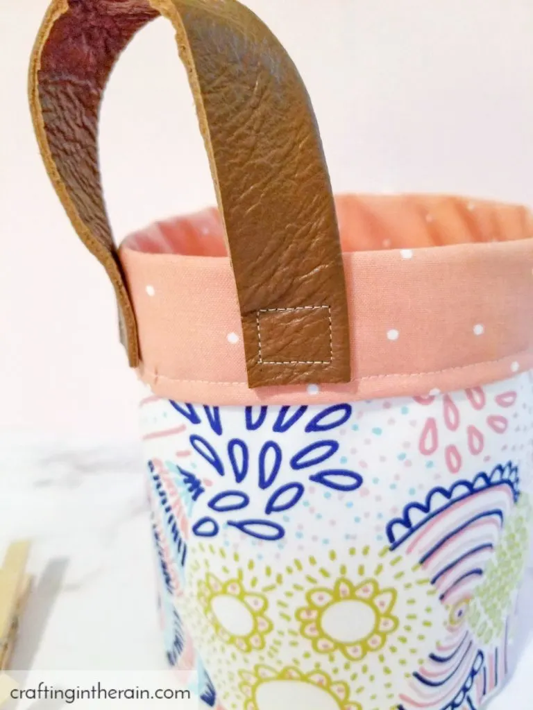 Leather handle on fabric basket