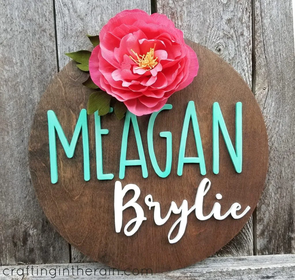wood name sign with paper flower
