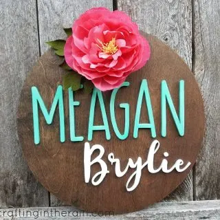 wood name sign with paper flower