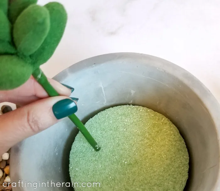 Insert faux succulent in foam