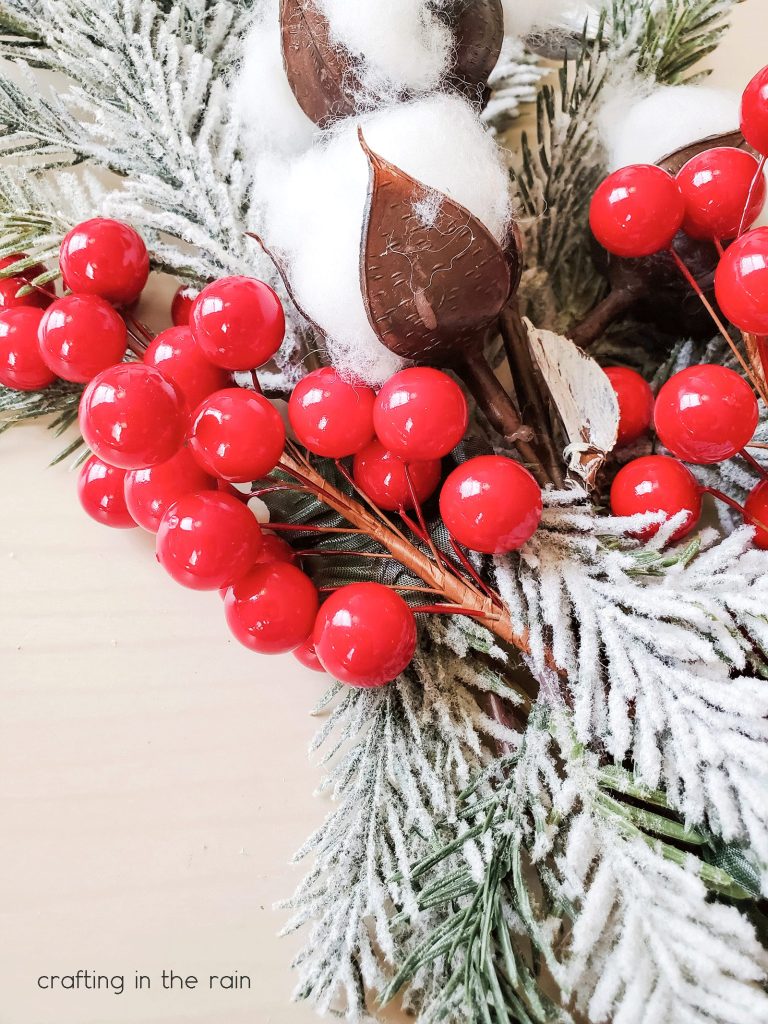 Red berries and cotton on wreath