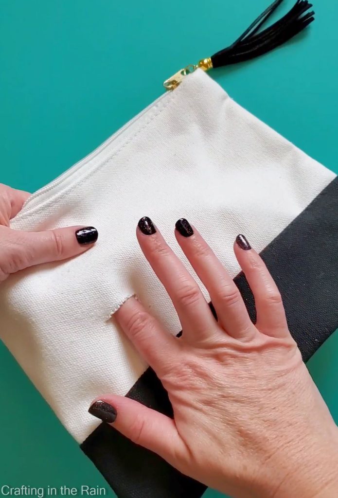 hole in a canvas pouch