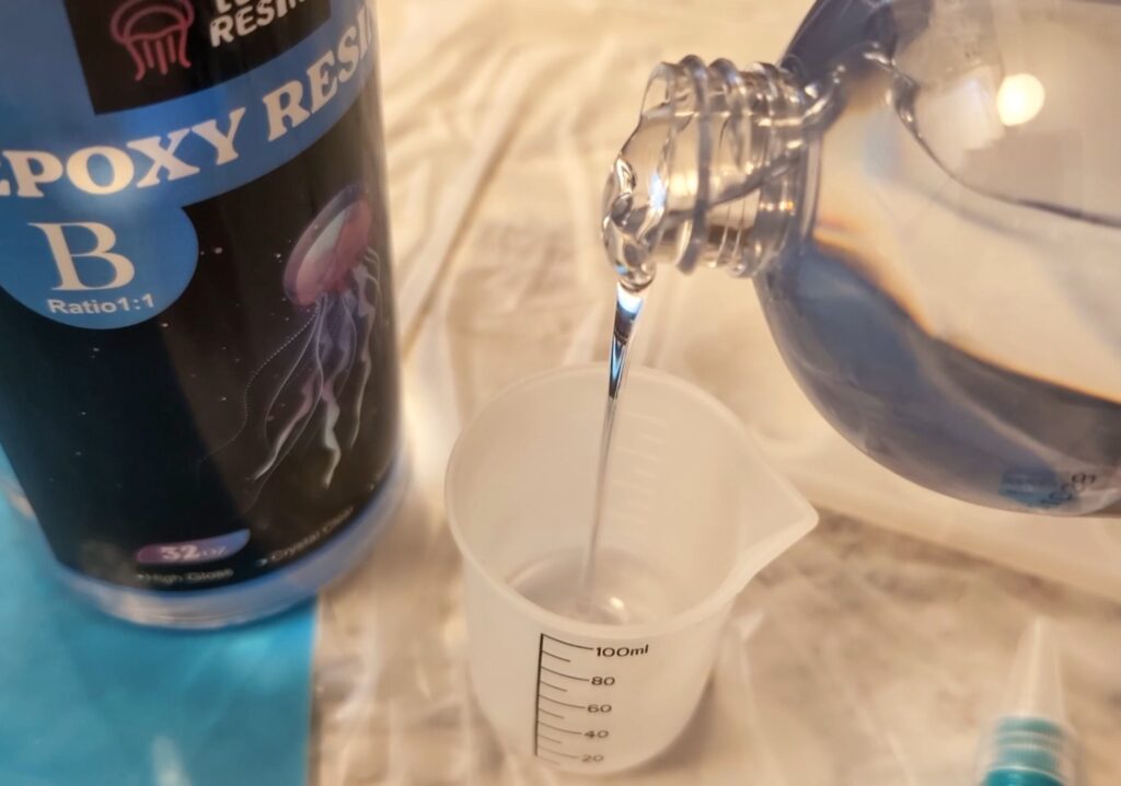Pouring resin to measure