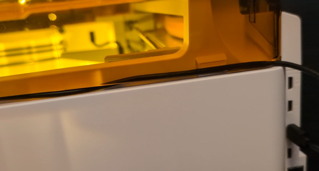 close m2 lid over cord